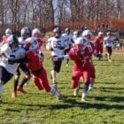 [CREDIT: Joe Hutnak] Pilgrim RB Jacob Soulliere (2) drives into the Toll Gate defense during the Thanksgiving Day game on Nov. 23.