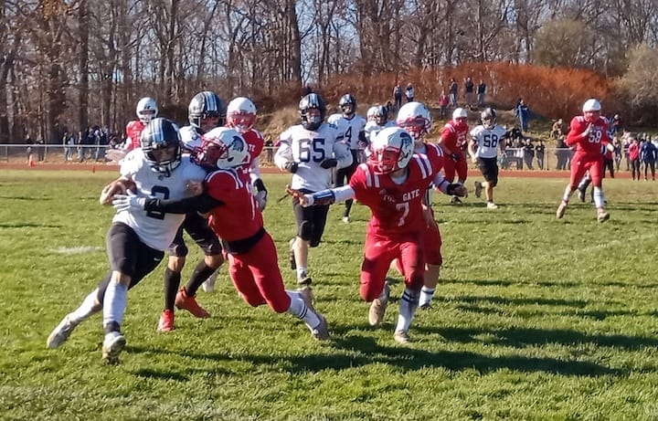 [CREDIT: Joe Hutnak] Pilgrim RB Jacob Soulliere (2) drives into the Toll Gate defense during the Thanksgiving Day game on Nov. 23.