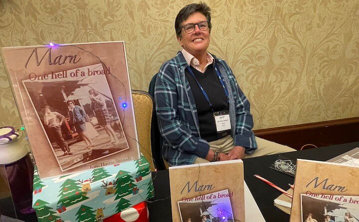 [CREDIT: Rob Borkowski] Kim Harris Stowell of Providence, and her mother's memoir, Marn, One hell of a Broad," at the RI Author Expo at Crowne Plaza Warwick Saturday. 