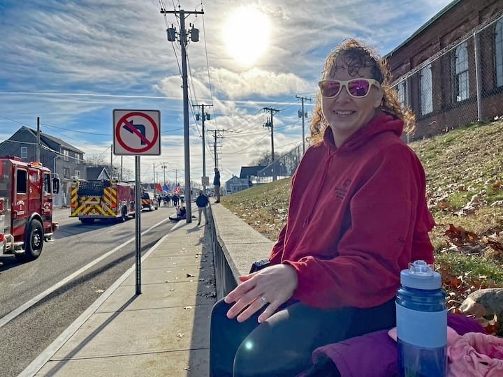 [CREDIT: Rob Borkowski] Shirlee Allenson had a good spot on Post Road to watch the Apponaug Winter Festival parade Dec. 9. 