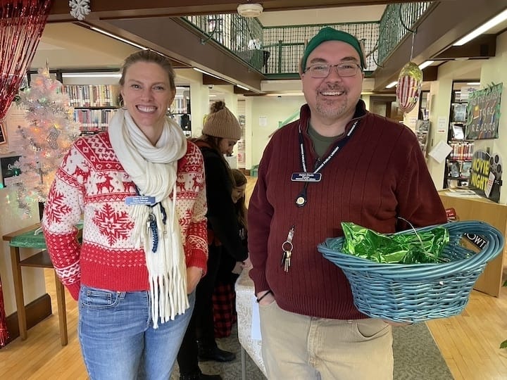 Inside the Apponaug Branch Warwick Public Library,Warwick Public Library Directors Ellen-O'Brien and Aaron Coutu-Jones greeted visitors at the door during the Apponaug Winter Festival. 