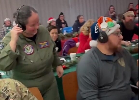 [CREDIT: NORAD Santa Tracker] Inside the NORAD Santa Tracking Center, where updates are provided in nine languages, including Japanese, pictured here, as the operation helps families track Santa Christmas Eve.