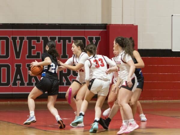 [CREDIT: Oaker Athletics/Facebook] Coventry's defense collapses around the Scituate offense on Dec. 11 in Coventry sports.