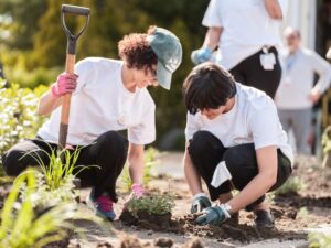 [CREDIT: CNE] Kent Hospital's DEI Council did some spring gardening at the hospital's entrance Tuesday.