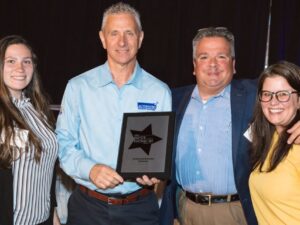 [CREDIT: ABS] From left, ABS staff: Lily Silveira, HR Coordinator; John Papa – Production Print Specialist; David Aulisio – VP of BusinessDevelopmet and Jen Thomson, VP of Sales and Marketing, the first ABS woman VP.