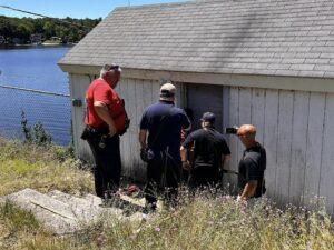 [CREDIT: James LeBlanc] At far right, Town Councilman Jonathan Pascua photographs the entry of town personnel into the pump house at Johnson's Pond & Dam June 28, 2024.