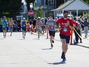 [CREDIT: Laura Paton] Tyler Shammas of Warwick nears the finish line in Saturday’s Gaspee Days 5K race, with a time of 20:32.