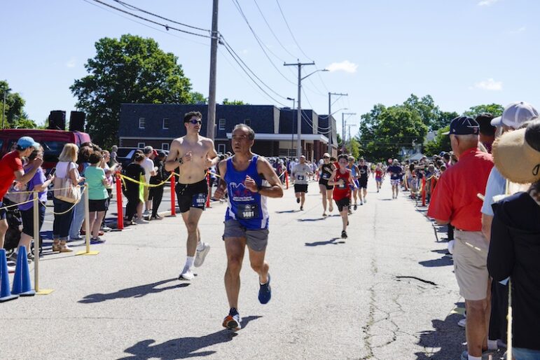 [CREDIT: Laura Paton] Hundreds line the street to cheer on the more than 1,700 runners during the June 8 Gaspee Days 5K.