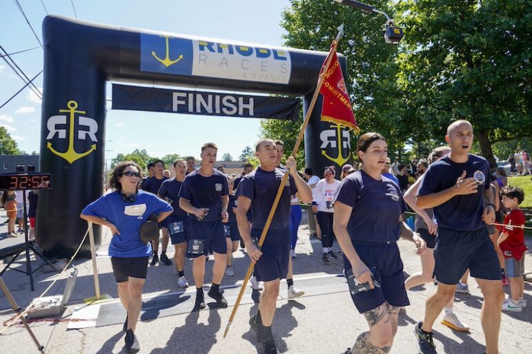 [CREDIT: Laura Paton] Recruits of the West Warwick Fire Department cross the finish line as a team during the June 8 Gaspee Days 5K.