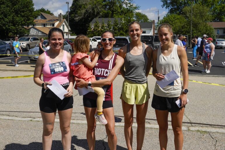 [CREDIT: Laura Paton] The top female runners from Saturday’s Gaspee Days 5K race. At left, Shayna Cousineau, 25, of Cranston, with a time of 18:20, fifth place. At right is the top female finisher, Tessa Hunt, 18, of Providence with a time of 17:24.