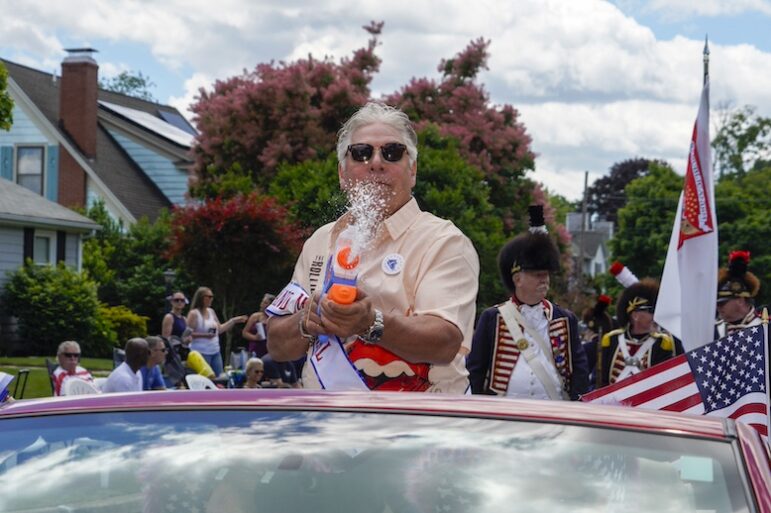 [CREDIT: Laura Paton] Gaspee Days Parade Grand Marshal Dean Scanlon, cools the crowd with his water gun during the 2024 Gaspee Days Parade June 8.