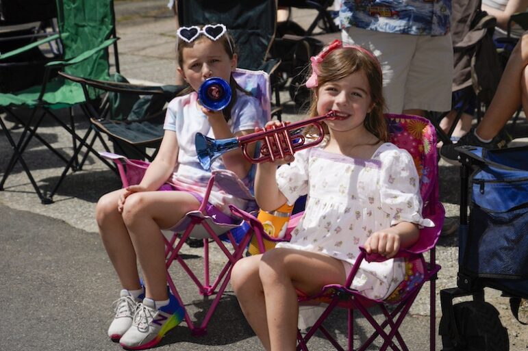 [CREDIT: Laura Paton] Arianna Arrighie and Maya Clesas make some noise during the 2024 Gaspee Days Parade June 8.