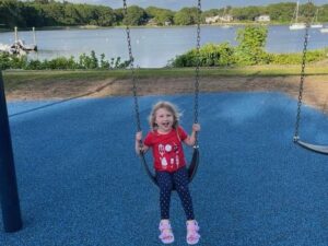 [CREDIT: Steve McAllister] Steve McAllister's daughter enjoys the new swingset at Arnold's Neck, part of Warwick neighborhood APRA projects.