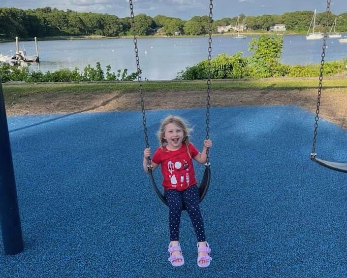 [CREDIT: Steve McAllister] Steve McAllister's daughter enjoys the new swingset at Arnold's Neck, part of Warwick neighborhood APRA projects.