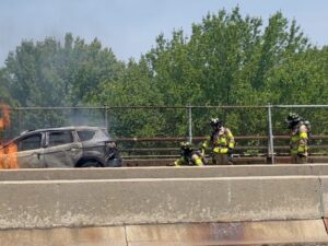 [CREDIT: Rob Borkowski] WFD firefighters from Tower Ladder 1 work to put out a stubborn East Avenue car fire Tuesday, June 18, 2024.