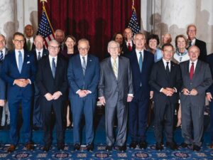 [Sen. Reed's Office] U.S. Sen. Jack Reed, far left, second row, with several Senators at the NATO summit in Washington, DC. At center are Senators Dem. majority leader Chuck Schumer and GOP minority leader Mitch McConnell.