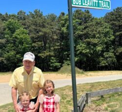 [CREDIT: Mayor Frank Picozzi] Bob Leavitt, pictured here at the sign marking Bob Leavitt Trail, which he helped build, in Warwick City Park.