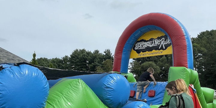 [CREDIT: Rob Borkowski] Inflatable attractions, courtesy of Bing's Backyard Bash, entertained kids during Granparent's Day at the Coventry Town Annex Saturday.