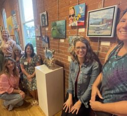 [CREDIT: Rob Borkowski] The Sketchbook Society, with their art showing in WCFA's annual Educators Art Exhibit. From left, Liz Fortier, Erica Meyer, Rena Rinker, Pam Regas (Seated, in pink), Kim Gallman, Kristen Noonan, Valery Nardacci, and Cathy Davis-Hayes. Aimee Georgistis, not pictured, also has work showing in the exhibit.