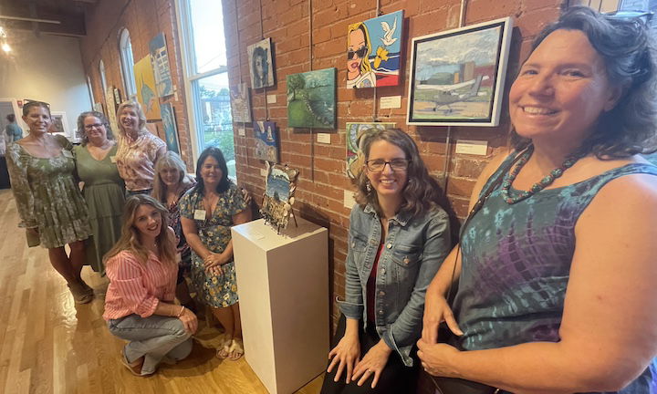 [CREDIT: Rob Borkowski] The Sketchbook Society, with their art showing in WCFA's annual Educators Art Exhibit. From left, Liz Fortier, Erica Meyer, Rena Rinker, Pam Regas (Seated, in pink), Kim Gallman, Kristen Noonan, Valery Nardacci, and Cathy Davis-Hayes. Aimee Georgistis, not pictured, also has work showing in the exhibit.