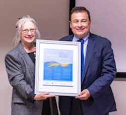 [CREDIT: LPPIB] Pictured above, CODAC Director Linda Hurley presents Speaker Joe Shekcarchi with a poster honoring his efforts to improve behavioral health.