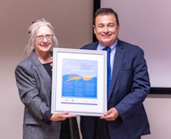 [CREDIT: LPPIB] Pictured above, CODAC Director Linda Hurley presents Speaker Joe Shekcarchi with a poster honoring his efforts to improve behavioral health.