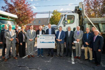 [CREDIT: Gov. McKee's office] At far left, Coventry Town Manager Dan Parrillo. In center, Rep. Joe Solomon Jr., Gov. Dan McKee, Sen. LaMountain, Sen. Mark McKenney, and, far right, Mayor Picozzi and Council President Steve McAllister, along with other officials, highlight the progress of RhodeRestore, the Governor's Municipal Road Grant Program aiding Warwick road repair efforts and that of other cities and towns.