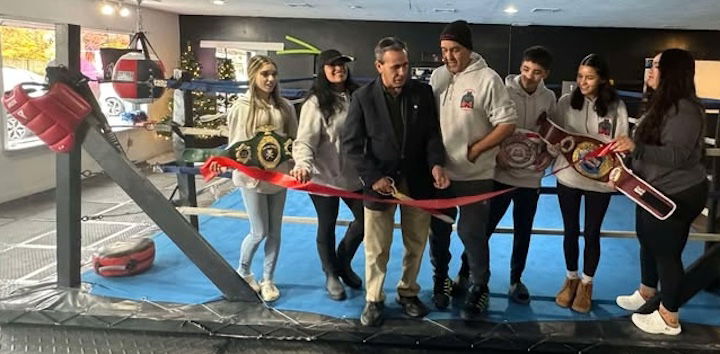 [CREDIT: Rob Borkowski] Mayor Frank Picozzi helps with the ribbon cutting at the Hard Knocks grand opening Saturday, Nov. 23.