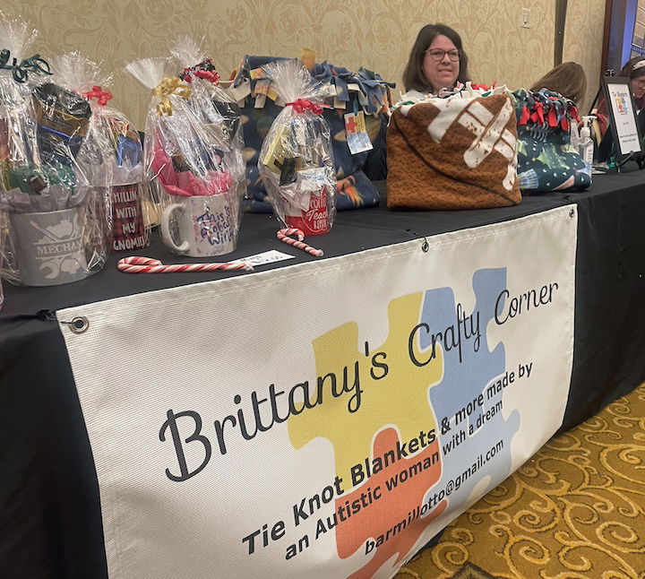 [CREDIT: Rob Borkowski] At Shop RI in Crowne Plaza, Brittany Armilotto, owner and creative force behind Brittany’s Crafty Corner, where she was selling her knotted double-layered blankets to eager patrons during Small Business Saturday.