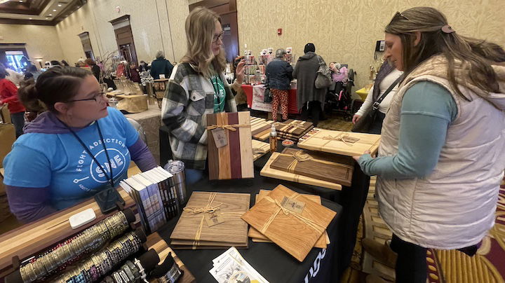 [CREDIT: Rob Borkowski] Caroline Bhatia and Tanya Wright were selling premium hardwood cutting, charcuterie, cheese boards, and butcher blocks, for the Adult and Teen Challenge, Southern New England Women at Crowne Plaza during Small Business Saturday.