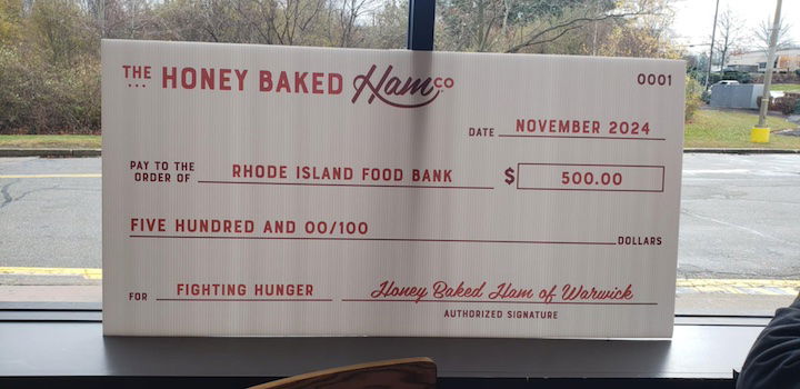 [CREDIT: Mary Carlos] The first Warwick Honey Baked Ham store opened at 300 Quaker Lane Nov. 23, when they made a $500 donation to the RI Community Food Bank.