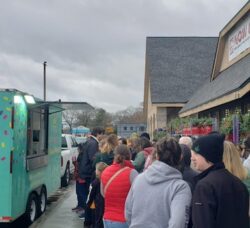 [CREDIT: Mary Carlos] People lined up outside the new Warwick Ocean State Job Lot Nov. 23 for complimentary donuts courtesy of the Poppin Minis Donut Truck.