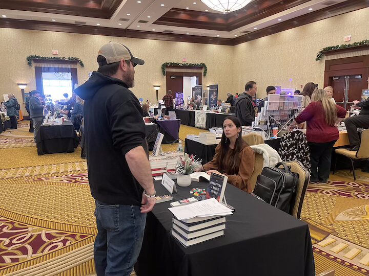 [CREDIT: Rob Borkowski] Bram Stoker Award-winning author Christa Carmen speaks with fellow Horror Writers of Rhode Island author Gage Greenwood.