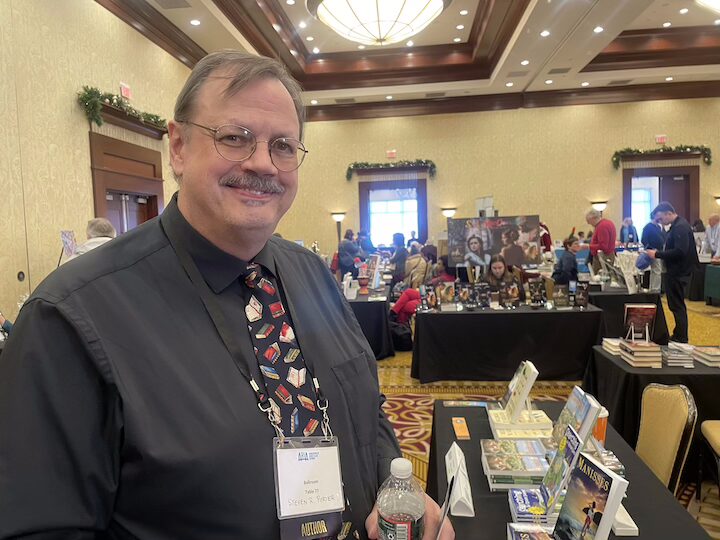  [CREDIT: Rob Borkowski] Steve Porter, owner of Stillwater Books in West Warwick and co-organizer of the RI Author Expo, at the event at Crowne Plaza Saturday.