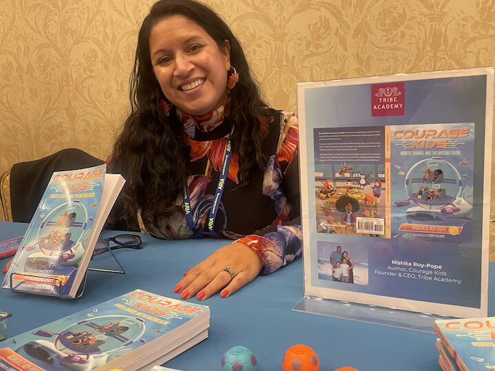 [CREDIT: Rob Borkowski] Nishita Roy-Pope with her children's novel series, "Courage Kids," which she wrote to inspire and empower the next generation of leaders, changemakers and innovators. Roy-Pope spoke about her book at the ARIA RI Author Expo at Crowne Plaza Warwick Saturday.