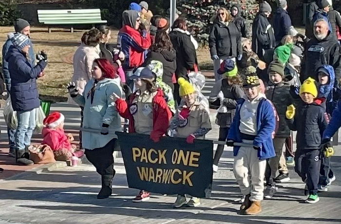 [CREDIT: Rob Borkowski] Cub Scout Pack 1 in the parade during the Rolling, Strolling Apponaug Winter Festival Dec. 7, 2024.