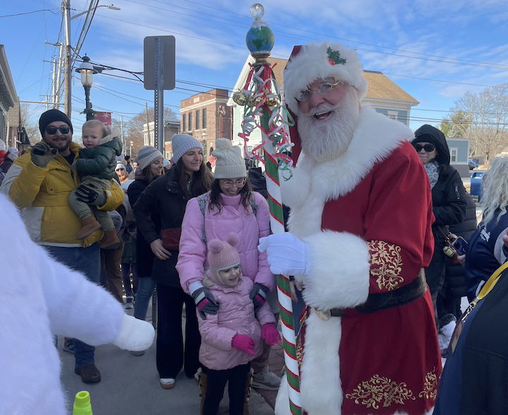 [CREDIT: Rob Borkowski] Santa and Mrs. Claus are ushered into the Central RI Chamber building for photos during the Rolling, Strolling Apponaug Winter Festival Dec. 7, 2024.