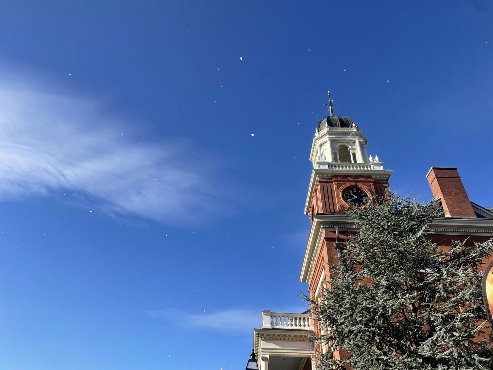 [CREDIT: Rob Borkowski] Foam snow is projected across the front of City Hall during the Rolling, Strolling Apponaug Winter Festival Dec. 7, 2024.