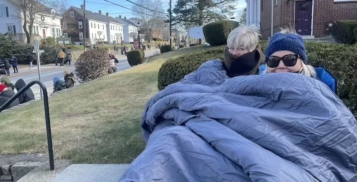 [CREDIT: Rob Borkowski] Linda Harr and Virginia Tonning bundle up with an elevated view waiting for the parade during the Rolling, Strolling Apponaug Winter Festival Dec. 7, 2024. The pair were there to see Hannah Tonning, 10 and Hazel Tonning, 8, march in the parade with Girl Scout Troop 18.