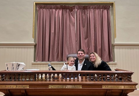 Warwick City Councilman Steve McAllister, with his daughter, Grace, 4, and wife, Vanessa, during his last Warwick City Council meeting Dec. 16, 2024, says 'See you Later' in the final Council Update.