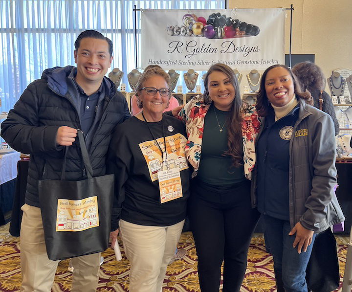 [CREDIT: RIDDC] From left, RI Treasurer James Diossa, Sue Babin,  chair of Shop RI, Sandra Cano, New England regional administrator for the U.S. Small Business Administration, and Lt. Gov. Sabina Matos during Small Business Saturday Shop RI at Crowne Plaza Warwick.