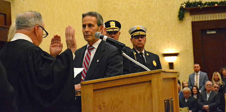 [CREDIT: Rob Borkowski] Ret. Supreme Court Justice Francis X. Flaherty administers the oath of office to Mayor Frank Picozzi during the Warwick Inauguration at Crowne Plaza Jan. 7, 2025. WFD Chief Peter McMichael and WPD Chief Brad Connor look on.