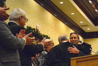 [CREDIT: Rob Borkowski] Ret. Supreme Court Justice Francis X. Flaherty and Mayor Frank Picozzi hug after Flaherty administered the oath of office at Crowne Plaza Jan. 7, 2025.