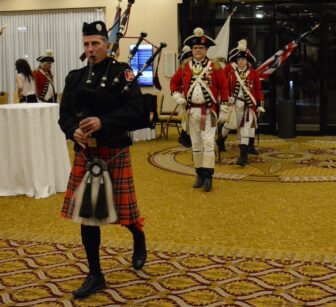 [CREDIT: Rob Borkowski] Warwick Fire Department's Carl Pecchia, Bagpiper, leads officials into the Crowne Plaza ballroom for the Warwick inauguration Jan. 7, 2025.